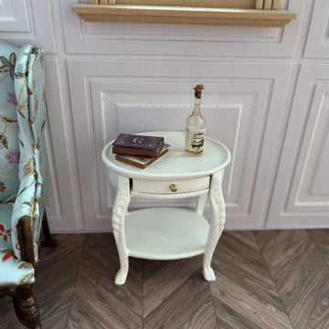 1:12 scale white oval tea table with drawer and lower shelf